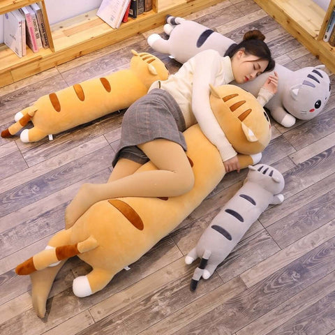 young woman cuddling cute kawaii chonky long XXL striped orange and gray kitty cat dakimakura body pillows for hugging