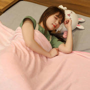 young woman sleeping on cute kawaii chonky bunny bubble tea pillow