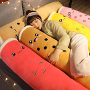young woman cuddling brown, red, yellow, and pink cute kawaii chonky bubble tea boba body pillow dakimakura