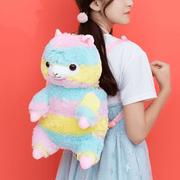 young woman wearing cute kawaii chonky rainbow color alpaca llama backpack