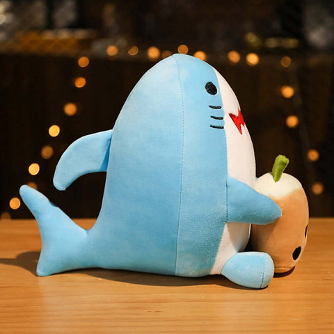 cute chonky squishy blue shark plushie holding boba bubble milk tea in side view