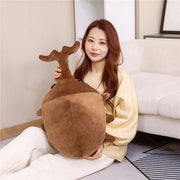 young woman cuddling cute kawaii chonky dark brown Japanese rhinoceros beetle plushie with horn
