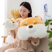young woman cuddling cute kawaii chonky shiba inu plush pillows and hand warmers