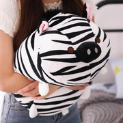 young woman hugging cute kawaii chonky squishy striped zebra plushie