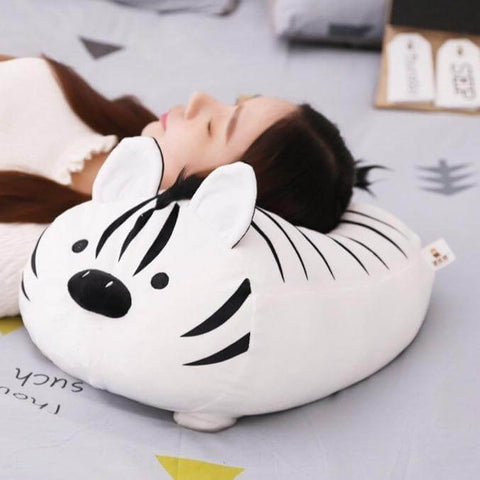 young woman sleeping on cute kawaii chonky squishy white zebra plushie