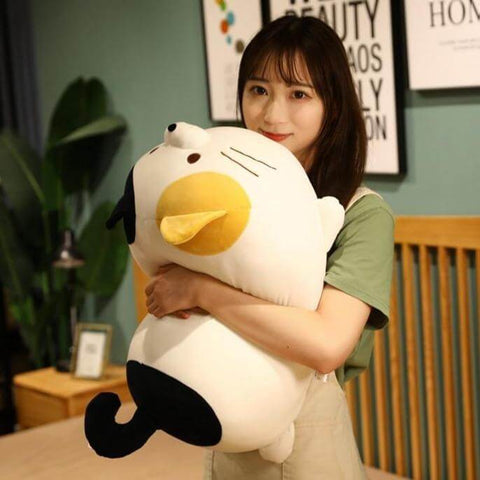 young woman embracing cute kawaii chonky squishy soft kitty cat plushies
