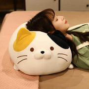 young woman lying on cute kawaii chonky squishy soft kitty cat plushies