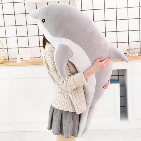 young woman hugging big huge XXL gray dolphin plushie pillow