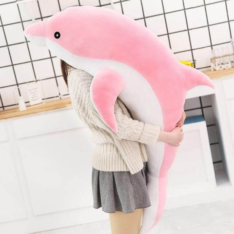 young woman hugging big huge XXL pink dolphin plushie pillow