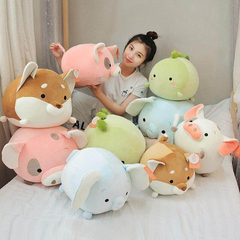 young woman cuddling cute kawaii chonky soft squishy round mochi animal plushies