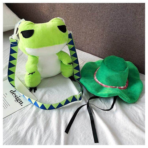 cute kawaii chonky green frog bag next to green hat