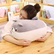 young woman sleeping on gray cute kawaii chonky angry shiba inu plushie