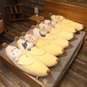 cute kawaii chonky banana animal plushies lying in bed