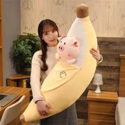 young woman holding cute kawaii chonky banana pig plushie