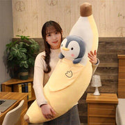 young woman holding cute kawaii chonky banana penguin plushie