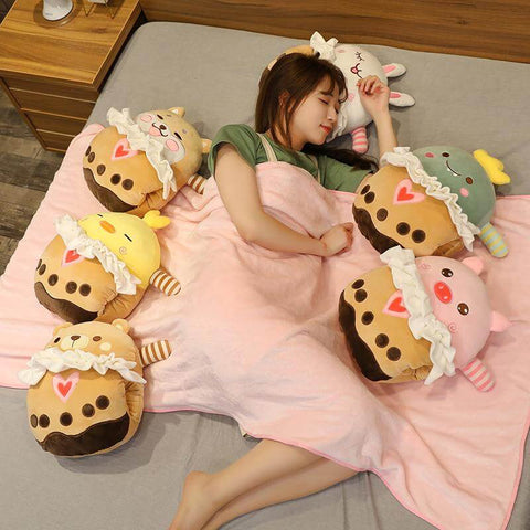 young woman next to cute kawaii chonky animal bubble tea pillows