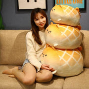 young woman holding cute kawaii chonky brown shiba inu bread melon pan plushies
