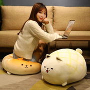 young woman sitting on cute kawaii chonky brown shiba inu bread melon pan plushies