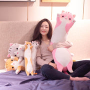 young woman cuddling and playing with big and long pink chonky cute kawaii cat plush dakimakura body pillow