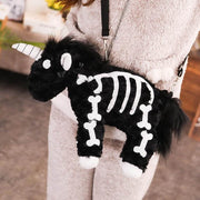 young woman wearing cute kawaii chonky fluffy Halloween black unicorn skeleton plushie handbag