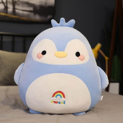 cute chonky squishy green penguin plushie with a rainbow on its belly