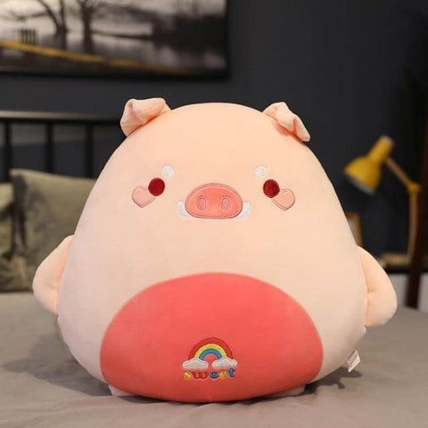 cute chonky squishy green pig plushie with a rainbow on its belly