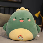 cute chonky squishy green dinosaur plushie with a rainbow on its belly