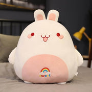 cute chonky squishy green bunny rabbit plushie with a rainbow on its belly