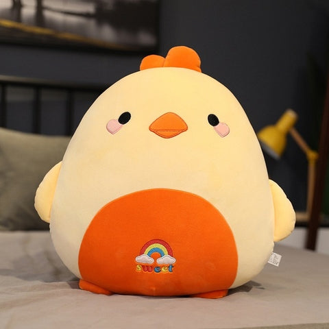 cute chonky squishy green chicken plushie with a rainbow on its belly
