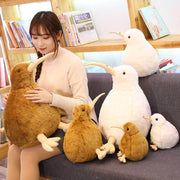 young woman cuddling with big fluffy soft chonky cute kawaii kiwi bird plushies