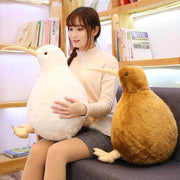 young woman holding big fluffy soft chonky cute kawaii kiwi bird plushies