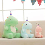 pink, green, and blue cute kawaii chonky dinosaur plushies with birthday party hats