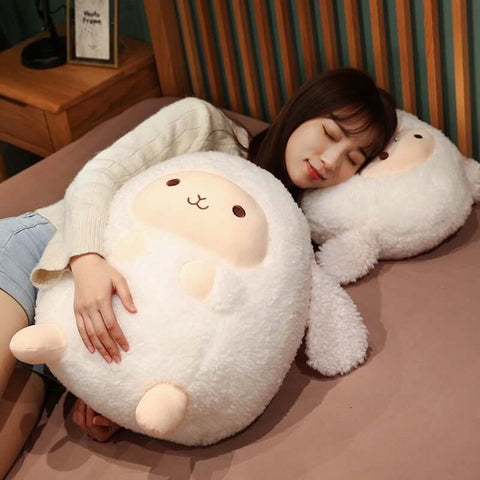 young woman cuddling with fluffy cute kawaii round chonky sheep plushies