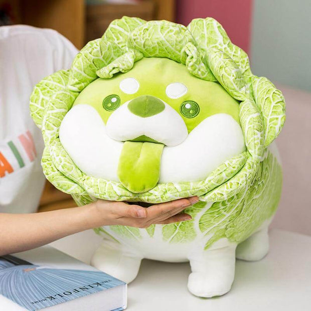 young woman playing with cute kawaii chonky green vegetable cabbage shiba inu dog plush