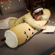 young woman playing with brown cute kawaii chonky bubble tea boba body pillow dakimakura