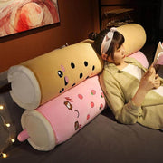 young woman sitting on brown and pink cute kawaii chonky bubble tea boba body pillow dakimakura