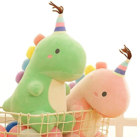 pink and green cute kawaii chonky dinosaur plushies with birthday party hats