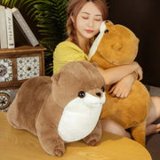 young woman cuddling with brown cute kawaii chonky soft otter plushies