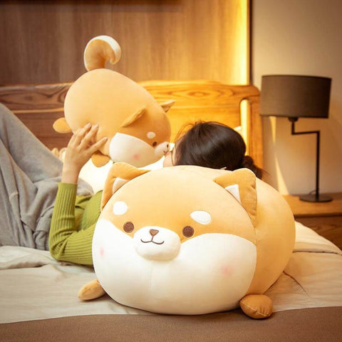 young woman loving orange brown cute kawaii fat chonky squishy soft shiba inu dog plushies