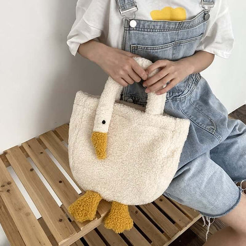 young woman wearing cute kawaii chonky soft fluffy goose neck tote bag handbag