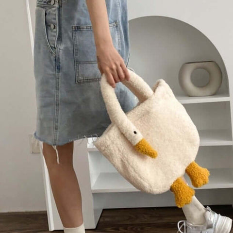 young woman going shopping with cute kawaii chonky soft fluffy goose neck tote bag handbag