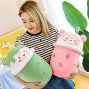 young woman holding pink and green cute kawaii chonky bear bubble tea boba plushies