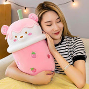 young woman holding pink cute kawaii chonky bear bubble tea boba plushie