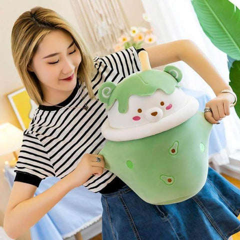young woman playing with green cute kawaii chonky bear bubble tea boba plushie
