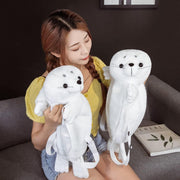 young woman wearing white fluffy cute kawaii chonky seal plushie backpack bags