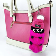 cute kawaii chonky pink cool caterpillar keyring with sunglasses, beanie, and sweater on a bag