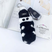 cute kawaii chonky black and white cool caterpillar keyrings with sunglasses, beanie, and sweater on a bag