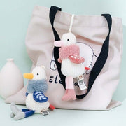 pink and blue cute kawaii chonky fluffy seagull bird plushie keyring in high heels shoes with quirky unique design on bag