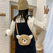 young woman wearing cute kawaii chonky fluffy animal head handbag and bag with shoulder straps in corgi dog design