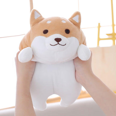 young woman cuddling cute kawaii chonky squishy brown shiba inu dog plushie with eyes open
